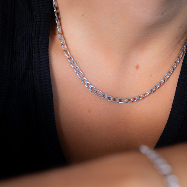 Figaro chain silver 5mm side shot, wearing black vest