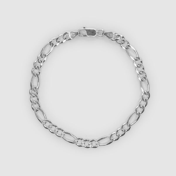 Silver chain bracelet on a light grey background