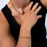 5mm gold rope bracelet and matching necklace worn with a black tank top, close-up view