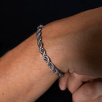5mm silver rope chain bracelet worn on the wrist, close-up view