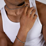 5mm silver wheat bracelet and matching necklace worn with a white tank top, close-up view