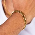 8mm gold Cuban chain bracelet worn on the wrist, close-up view
