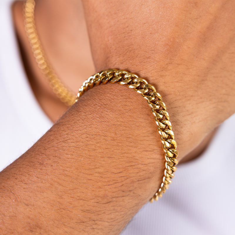 8mm gold Cuban chain bracelet worn on the wrist, close-up view