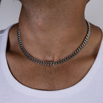 8mm silver cuban chain necklace worn around the neck, front close-up