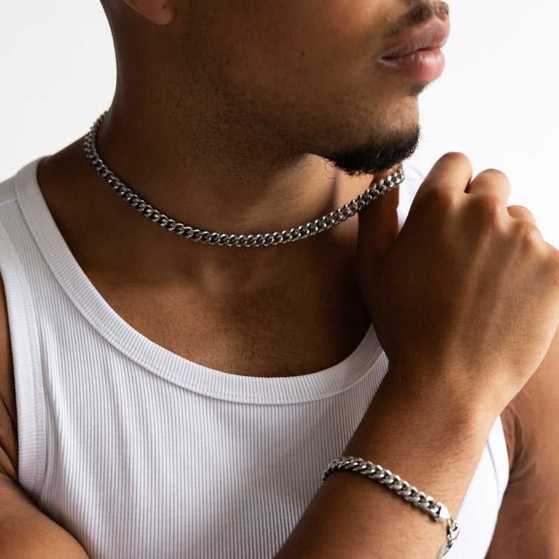 4mm silver cuban chain necklace worn around the neck, front close-up with matching bracelet 