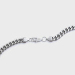 Silver chain on a light grey background
