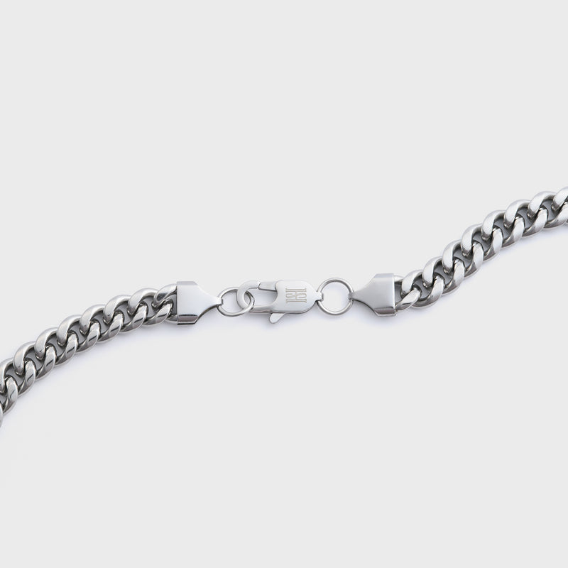 Silver chain on a light grey background
