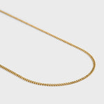 Curb chain gold 2mm side shot on light grey background