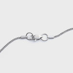 Curb chain silver 2mm clasp shot on light grey background