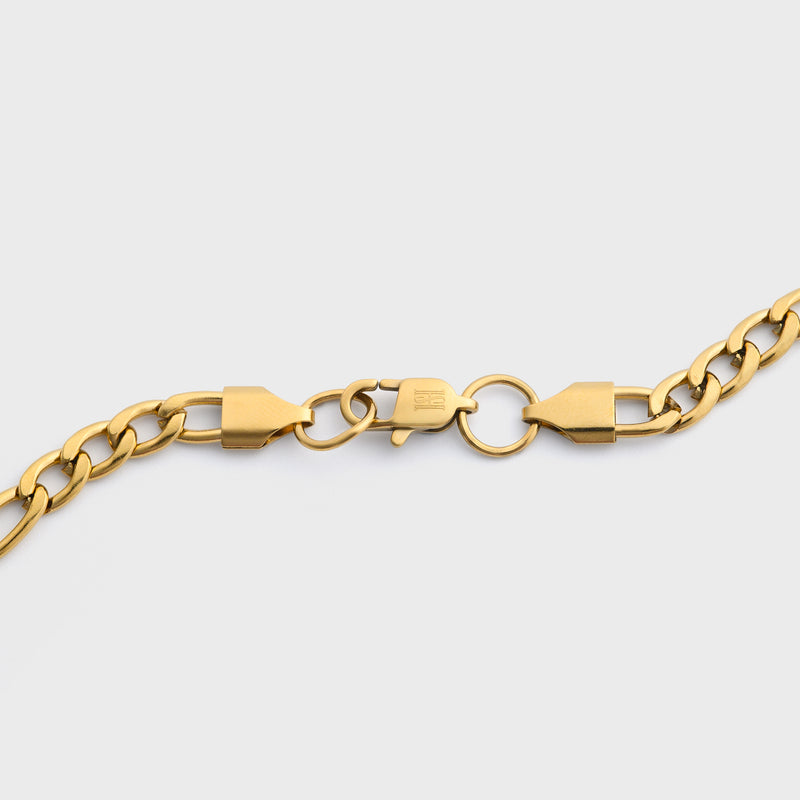 Figaro chain gold 5mm clasp shot on light grey background