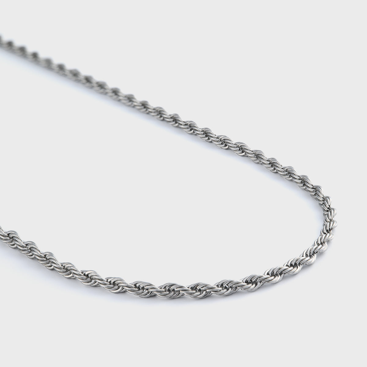 Rope chain silver 3mm side shot on grey background