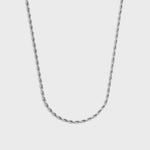 Silver rope chain on a light grey background