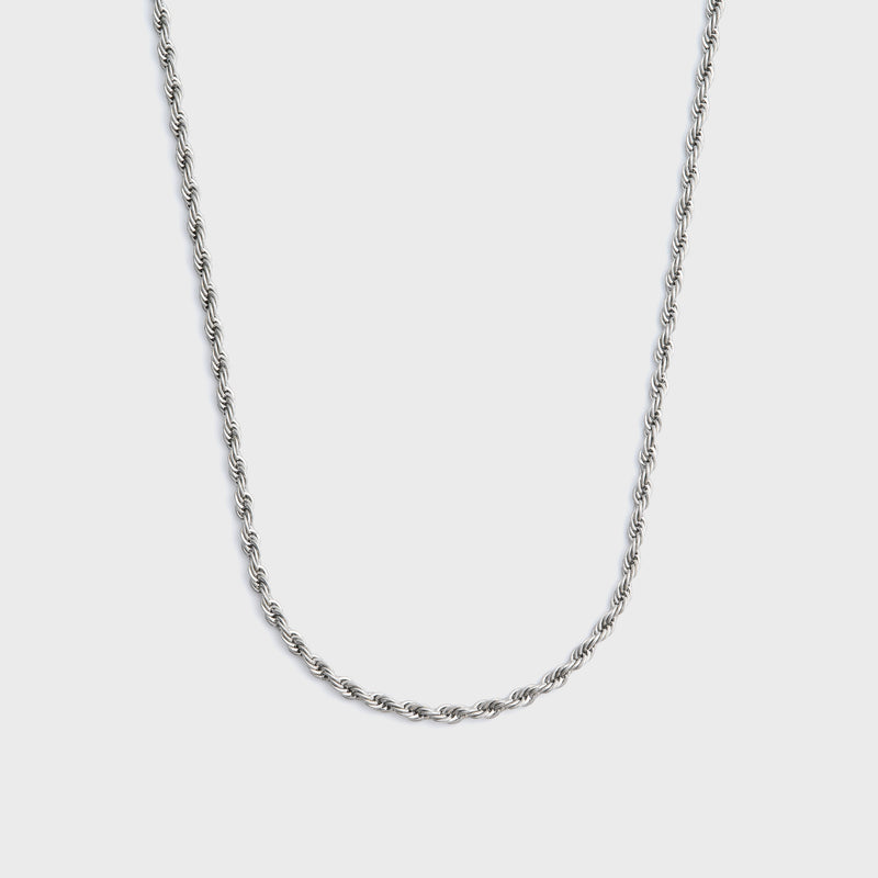Silver rope chain on a light grey background