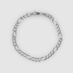 Silver chain bracelet on a light grey background